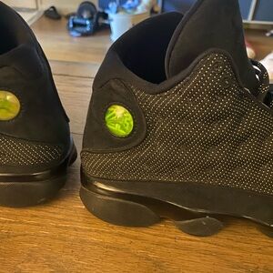 Black Sneakers with Green Accents
jordan 13 black cat 🐈‍⬛